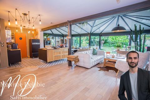 Maison d'architecte à Trangé avec garage attenant : élégance et nature en harmonie