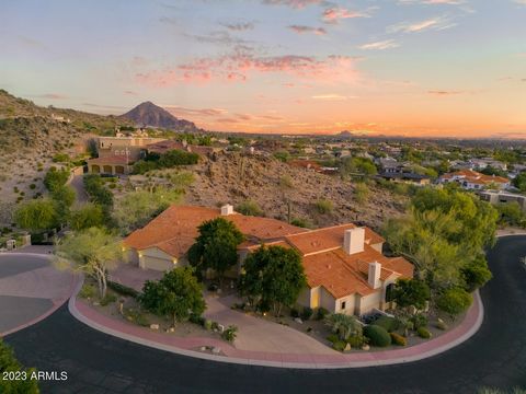 Nestled at the top of the exclusive Guard Gated Biltmore Mountain Estates, this unparalleled residence stands as a testament to luxury living in Greater Phoenix. Positioned within the serene Phoenix Mountain Preserve, the home enjoys a commanding van...