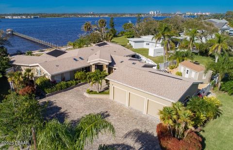 Your Riverfront Estate awaits. Check out this one-of-a-kind property on just shy of an acre, sitting high on a dune allowing for unmatched views of the intracoastal. This is a boater's paradise with a deepwater dock and boat lift. Property has been m...