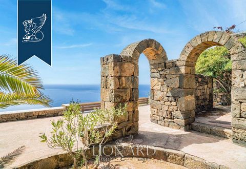 A luxurious villa on the island of Pantelleria on Sicily is sold. This impressive real estate is located on a panoramic hill overlooking the southern coast of the island and is a complex of four Dammusi, traditional local buildings with white domed r...