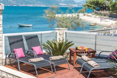 It is a pleasure for us to offer a wonderful stone detached villa with swimming pool located in the first line to the sea and just a short distance from the historic town of Trogir. Villa is right by the sea, beautiful beach is 200 meters from the vi...