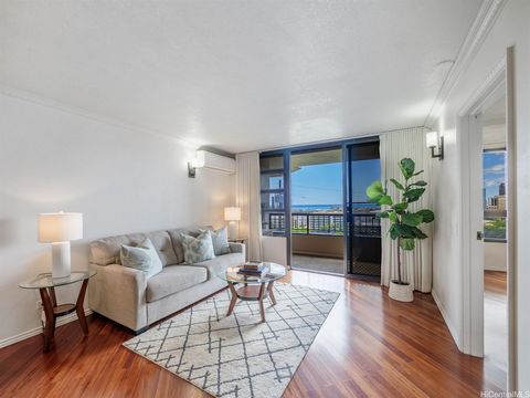 Welcome to Iolani Palms, rarely available 2-bedroom, 2-bath unit featuring tandem parking and stunning ocean and city views. Inside, an open floor plan showcases wood laminate flooring, granite countertops, stainless steel appliances, and new cabinet...