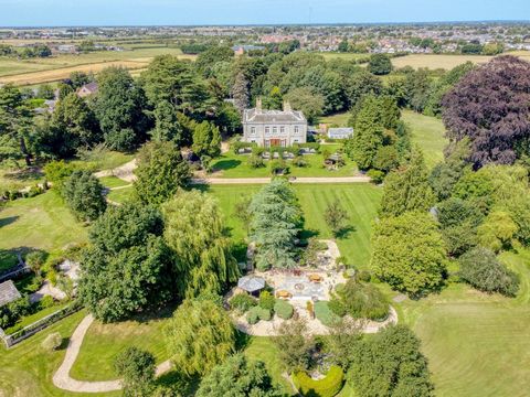 A Grade II Listed, 18th-century magnificent Lincolnshire estate of historic importance, privately nestled within its own parkland, forms an idyllic world of its own, yet is within easy reach of towns, cities, the east coast and Norfolk. Rich in stunn...