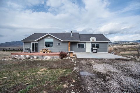 Experience a perfect slice of the beautiful Bitterroot Valley. This property is over 6 acres of 360 degree views; mountains, meadows and the valley, not to mention being adjacent to state land. This 4 bedroom, 2.5 bath home is tastefully done with li...