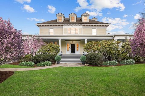 Tucked away atop a hill on 1.2 acres, this classic Colonial offers the perfect blend of original detailing, modern amenities and convenience. The property exudes privacy, surrounded by mature plantings and idyllic specimen trees. The circular drivewa...