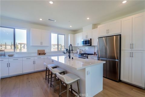 Like a Model Home! Boasting 1320 square feet of living space, this 2 bedroom 2.5 bath built in December 2023 offers a a perfect feel of comfort and tranquility. Stunning blonde oak wood floors throughout with carpet in the bedrooms, Paid off solar, P...