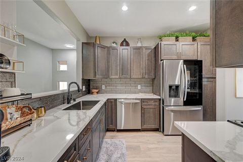 Welcome to the Prestigious Summerlin Community! This STUNNING 3-bd, 2-B condo has undergone over $50k in upgrades, offering an unparalleled blend of Luxury & Comfort. Ascend the stairs to find an inviting living space w/Vinyl & Tile Throughout. (NO C...