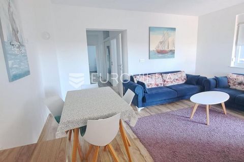 Zadar, Turanj, two-room apartment on the ground floor of a residential building, gross floor area 70.68 m2. The apartment consists of an entrance area, an open concept kitchen, dining room and living room, two bedrooms, a bathroom and a covered terra...