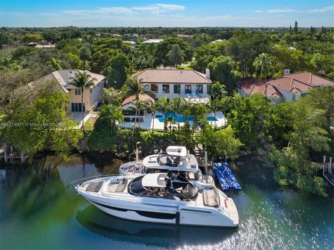 This elegantly redesigned turnkey waterfront masterpiece at 284 Las Brisas in the highly desirable Islands of Cocoplum, with no bridges to Biscayne Bay and direct ocean access, is ideal for boating enthusiasts. Meticulously renovated down to the stud...