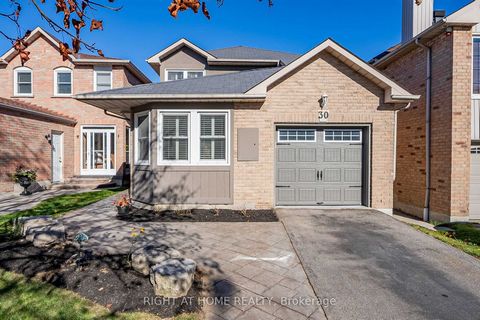 This beautiful West Rouge home offers the perfect blend of modern living and convenience, situated just steps to Rouge National Urban Park, Rouge GO, and TTC. As you arrive you will note the professionally landscaped gardens, and stamped concrete wal...