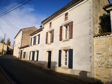 Nice house with charantaise stones and a garden across the road. The entrance has a nice wooden staircase going all the way to the attic. On the right we have a room (dining room) and on the left the living room with a chimney and exposed stones. Nex...