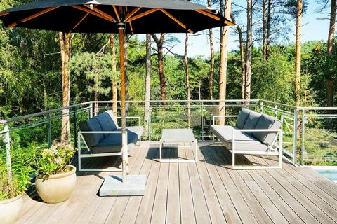 Architect-designed cottage with outdoor hot tub located at the end of a quiet road in Lyngsbæk. The cottage is excitingly decorated and here the details are really meticulous. The house offers i.a. on large bathroom and fantastic kitchen / living roo...