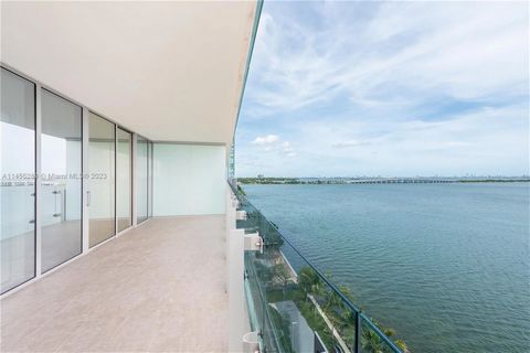 Explore the irresistible charm of Missoni Baia's masterpiece, nestling two bedrooms and 2.5 bathrooms in its 1,910 square feet, bathed in natural light and offering stunning panoramic views of Biscayne Bay. You'll love the marble floors, European cab...