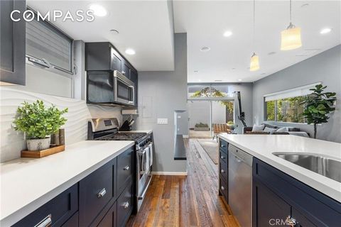 Welcome to this modern architectural two-story single-family home, boasting three bedrooms and high-end custom finishes. Upon entry, soak in the natural light that floods the interior, creating an inviting atmosphere accentuated by hardwood floors re...