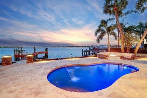 Waterfront Oasis with private dock in St. Petersburg, FL. Superior craftsmanship combined with elegance defines this custom-built 3 story home found on the tranquil waters of Tampa Bay. This home is built to last with its impressive exterior all bloc...