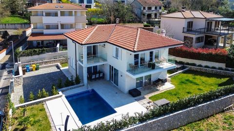 Constructed in 2022, this modern building is nestled in a tranquil area near Malinska, tucked away in a cul-de-sac and surrounded by upscale villas and vacation homes. The 154 m2 villa on 410 sq.m. of land is spread across a ground floor, a first flo...