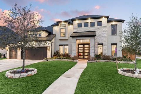 Welcome to 29007 Ally Lynn Way, in the prestigious master-planned community of Firethorne, zoned to Lamar Consolidated ISD. This modern architectural gem offers 5 bedrooms, 4.5 baths, and an impressive 4-car garage. Step into a grand foyer with soari...