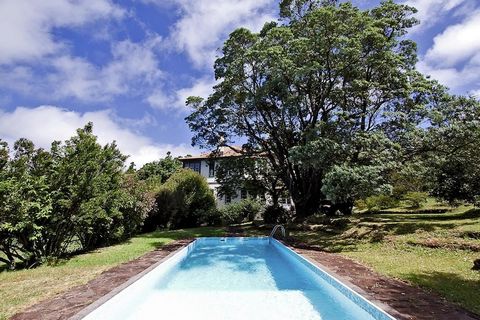 Surrounded by beautiful views, this modern cottage in Santo António da Serra features warm décor. It offers a peaceful refuge for a family or group of friends looking for an accommodation on the Island of Madeira. The cottage features a shared pool a...