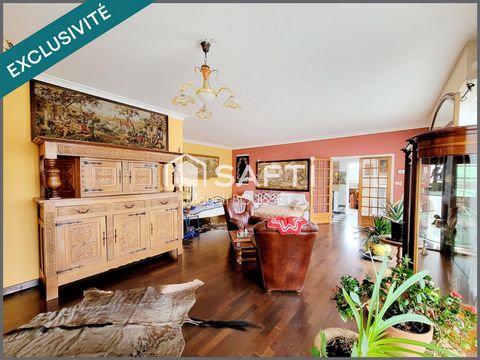 Maison traditionnelle T5 de 160m², trois chambres, dressing, véranda, terrasse avec vue, garage et atelier, jardin idéale pour une grande famille.