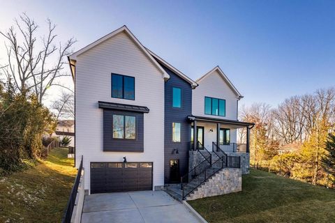 Nestled in the heart of Falls Church, this newly constructed contemporary home is a masterpiece of design and craftsmanship. Spanning over 5,552 square feet of luxurious living space, this property features 9' ceilings across all three levels, hardwo...
