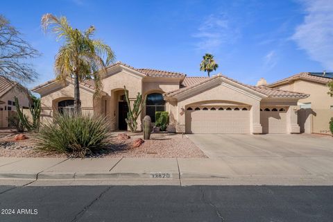 **Priced under appraisal** Soaring 12 ft. ceilings, natural light and open floorplan is what you'll first notice as you enter through the expansive front door. The wall of windows will naturally draw you out to the sparkling pool and patio. The priva...