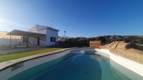 Beautiful and bright country house in Coín with a build size of 70m², located on a 929m² plot. The property features a storage room, a covered terrace, and a swimming pool. It is two storeys and is distributed as follows: Ground Floor: Open-plan livi...