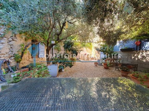 BETWEEN UZES, NIMES AND AVIGNON: Large stone village house with garden and 2 terraces with commercial potential. Located in the centre of a charming village with bakery, local shops and restaurants, this property with undeniable charm is equipped wit...