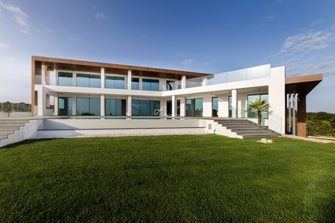 Located in Vila Real de Santo António. An exceptional and contemporary 6-bedroom property (5+1 additional basement accommodation) in Monte Rei Golf Resort overlooking the ocean and the first fairway of Monte Rei Northern Golf, just ten minutes from t...