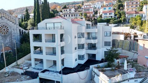 Location: Primorsko-goranska županija, Opatija, Opatija - Centar. A high-quality new building with 9 apartments was built in a prime location not far from the center and the beach. By car, you come directly to the garage, where there are spaces for e...