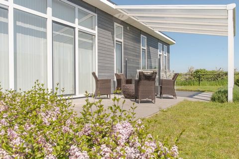 This beautiful, detached accommodation is located on the edge of this holiday park. The fresh and light interior has been put together with great care, so that you will immediately feel at home. The high-quality kitchen, equipped with high-tech equip...