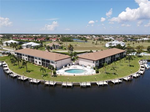 PUNTA GORDA ISLES-BAL HARBOR PLACE. 1st FLOOR, CORNER UNIT! YOU WILL ENJOY THE CONVENIENCE OF THIS FIRST FLOOR, FURNISHED (MINOR EXCEPTIONS) AND TURN-KEY, WIDE CANAL BASIN-VIEW UNIT WITH DEEDED DOCK AND ASSIGNED CARPORT! THIS UNIT IS LIGHT, BRIGHT, C...