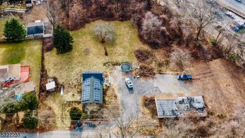 Calling all contractors, developers, or people who just need lots of space for toys! This is not your normal house for sale! Set on 2 acres, with a main house, a large accessory structure, and ample flat yard & parking, this property is the perfect f...