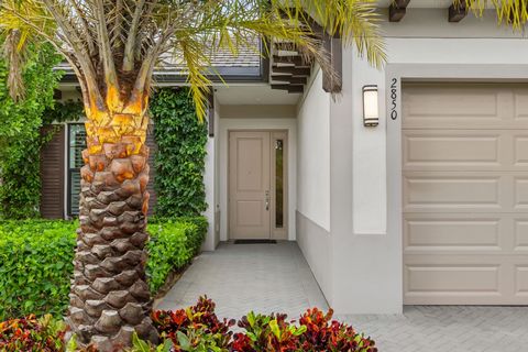 Luxuriate in total elegance with this extensively upgraded Cayman model home in the sought-after community of The Residences at Banyan Cay Resort & Golf. Priced to sell. Step inside this single-story new-construction, open floor plan home and be gree...