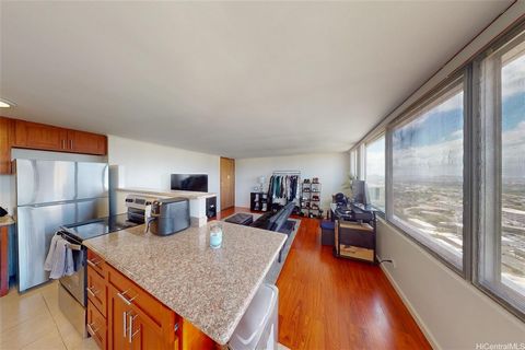 Experience convenient island living in this charming 1-bedroom, 1-bathroom condo nestled in the heart of Aiea. This cozy residence offers a comfortable living space with ocean views. The open floor plan maximizes space and natural light, creating a w...