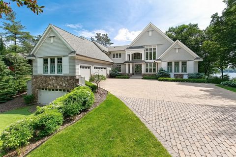 Breathtaking Lake Minnetonka masterpiece on a private 1.17 acre lot with 150' of rip-rap shoreline! This recently refreshed East Coast influenced home features a light & bright open floorplan with floor-to-ceiling windows showcasing gorgeous water vi...
