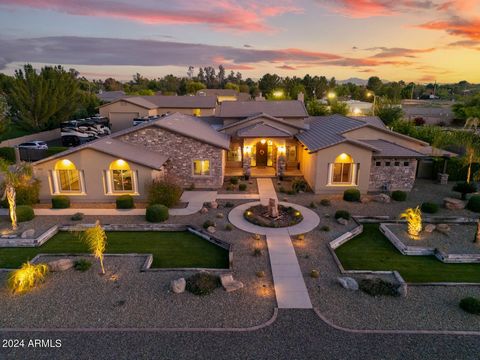 THIS BEAUTY HAS IT ALL! STUNNING CUSTOM 1.2 Acre ESTATE w/ 2B/2B GUEST HOUSE, BASEMENT, THEATRE ROOM, 4 CAR GARAGE + DOUBLE RV GARAGE with Detached HOME OFFICE that includes AC & HEAT! NO HOA! FLOOD IRRIGATION! Luxurious open floor plan perfect for e...