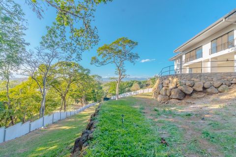 ID# 117076. Beautiful modern house with panoramic views for sale in La Guácima, Alajuela. 3 bedrooms, 3.5 bathrooms, 428 m2 of construction, 5000 m2 of land, US$ 890.000. Majestically rising in the prestigious Residencial Villas del Arroyo is The Roc...