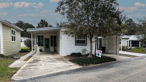 Welcome home to this lovely and charming 877 sq.ft. under air, 2Br/2Ba. manufactured home, located in Lake Helen Villa a 55 plus community, with access to a vibrant small town community lifestyle.... This home features an open concept kitchen with st...