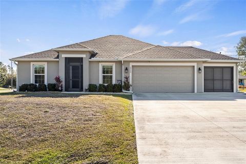 Welcome to this beautifully maintained 3-bedroom, 2-bathroom custom home built in 2020, offering the perfect blend of style, comfort, and security. Nestled on a desirable corner lot, this home boasts an extended lanai, ideal for outdoor living and en...