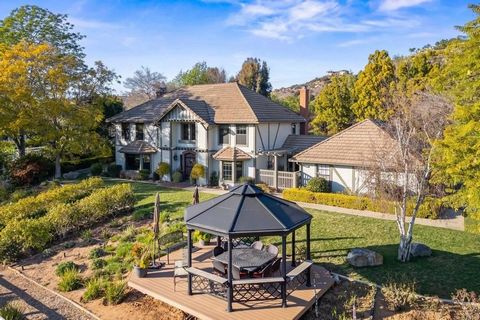 Discover an extraordinary equestrian estate nestled in the highly desirable Saratoga Estates gated community. This impressive property spans 2.5+ acres, offering private access to an exclusive trail system that winds its way through the community. Dr...