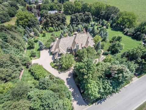 Opulent English Manor Estate on a premier 2 acre lot with lavish landscaping, multiple pools, waterfalls, verandas, and so much more! This estate is within a 5 minute drive to the bustling art and food district of downtown St. Charles and .5 miles aw...