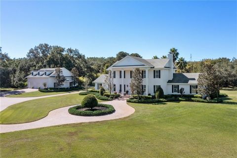 Welcome to this stunning 10-acre estate featuring a custom-built traditional-style two-story home and matching detached garage, meticulously constructed by Sam S. Sadler III, Inc. in 2004. The property boasts well-manicured mature landscaping and off...