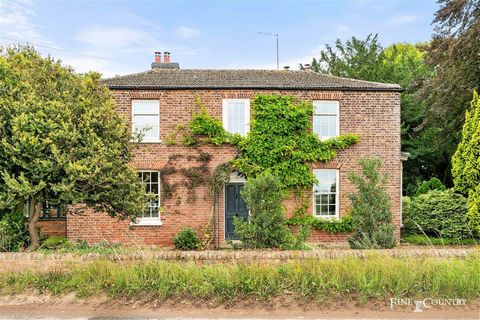 A charming, Victorian, former farmhouse with an enormous amount of space both inside and out, sits in a rural position about a mile north of the A17 and a minute or so further to the market town of Holbeach. Spalding, a very pretty market town with e...