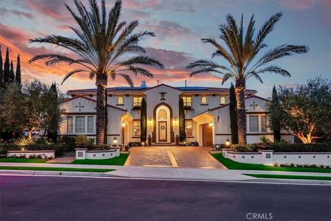 Presenting a Sparkling Star of Whispering Hills with a stellar location perched atop a prime lot set back on a single loaded street, a sought-after location overlooking this gated community, blessed with the most prized Plan 6 floorplan and an entert...