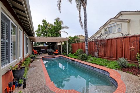 Welcome home! Check out this Talbot Drive oasis in Morgan Hill. This single story 2533 sq ft home has 4 bedrooms, 2 baths, sparkling pool, hot tub, plantation blinds, ghost screens, travertine kitchen floor, hardwood throughout. Open floor plan, grea...
