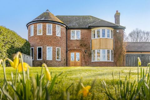 An expansive, extended family home is presented in immaculate order and offers 5 bedrooms, 2 en suite, a family bathroom, 2 impressive reception rooms, a superb kitchen dining room, a utility room and a downstairs shower. The house flows easily betwe...