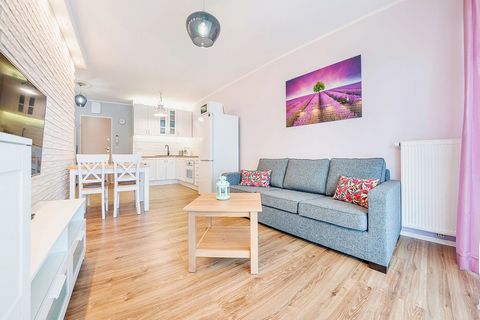 The apartment is located in Sopot, at Łokietka 55L Street in the Krolewskie Kamieniczki estate has a living room with a kitchenette, a dining table with chairs, a double sofa bed, a coffee table, and a TV. From the living room, there is an exit to th...