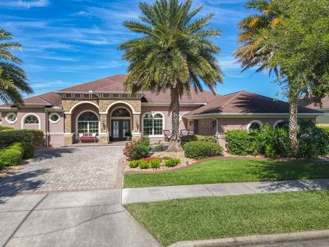 Explore the elegance of Promenade Parke with this luxurious waterfront pool home in a peaceful and quiet neighborhood. This home features hand-scraped hardwood floors and detailed tile work. A wine room. The open layout includes a formal dining area ...