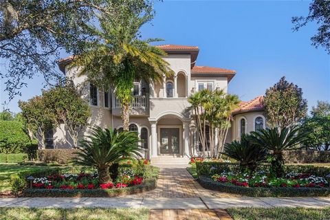 BACK ON THE MARKET! Gorgeous Spanish Mediterranean custom home by Stonebridge Homes in one of the best sections of desirable Keenes Pointe! Luxury abounds in this incredible 5 bedroom, 6 bathroom, estate home with over 5300 sq ft on a 1/2 acre +/- lo...