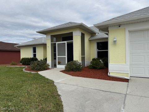 Beautiful 2004 Home in Quiet Cape Coral Neighborhood This home offers modern upgrades and a functional split floor plan. The spacious great room, featuring high ceilings and tile flooring, is the center of the home, creating a welcoming and open atmo...